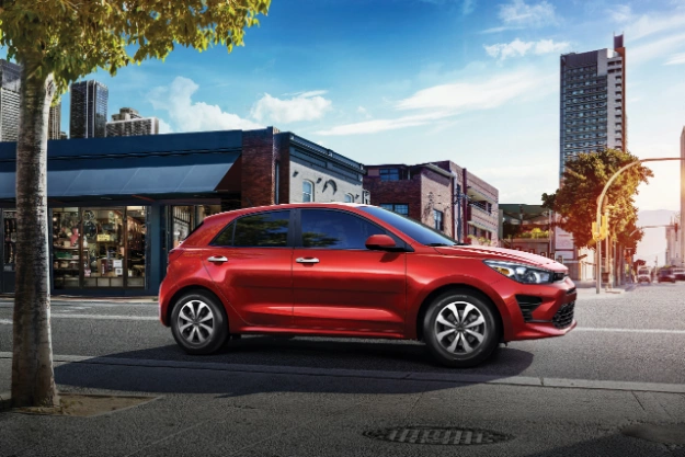 2022 Kia Rio 5-Door Driving On A City Street Side View