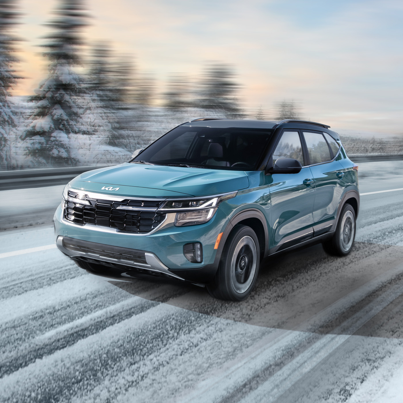 2024 Kia Seltos Driving Through a Snowy Road Utilizing All Wheel Drive With Lock Mode Three-Quarter View