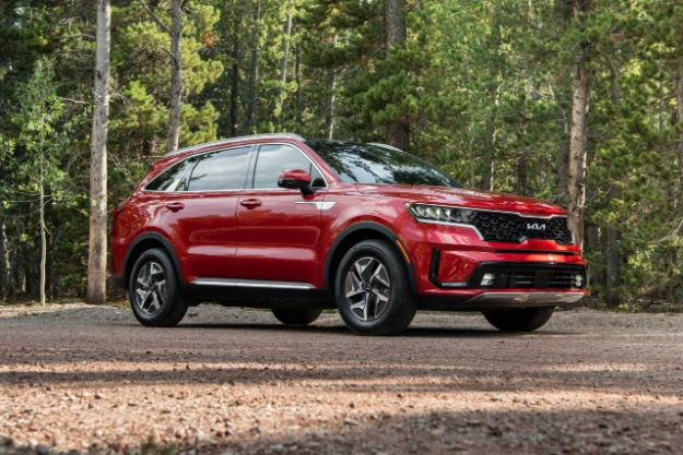 2023 Kia Sorento Hybrid Parked Off Road In A Forest Three-Quarter View