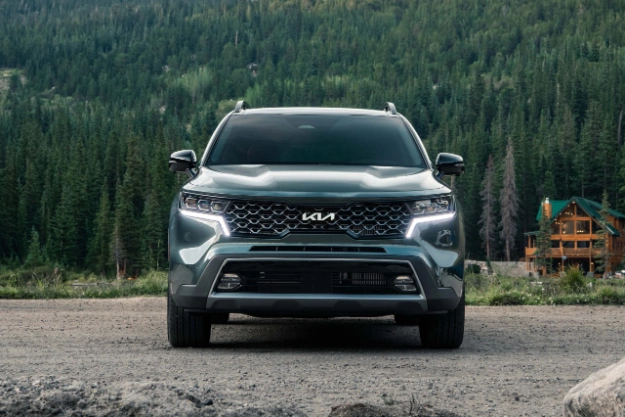 2023 Kia Sorento Parked In Front Of A Cabin And Trees Front View