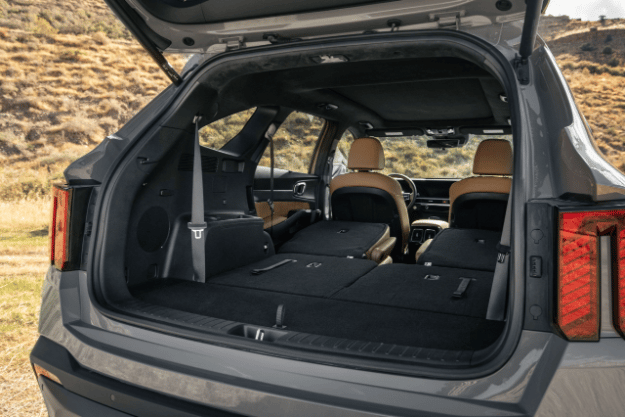 2025 Kia Sorento back view with the trunk open, second and third row seats up to show cargo space
