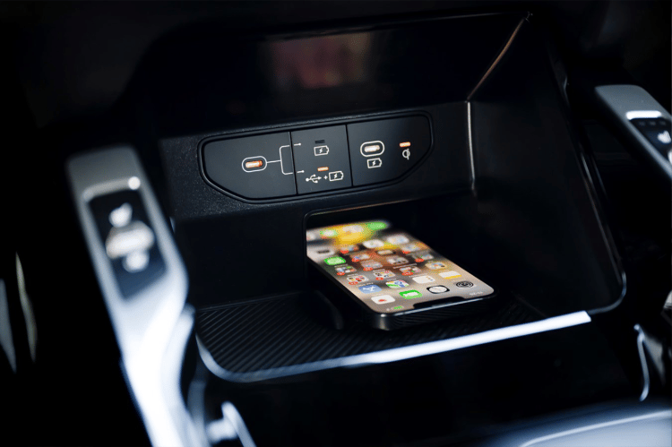 2025 Kia Sorento X-Pro SX Prestige AWD interior, zoomed in view of the USB station with a phone inside