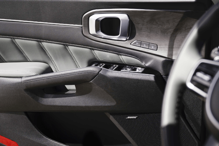 2025 Kia Sorento X-Pro SX Prestige AWD interior with sage green trim on the door