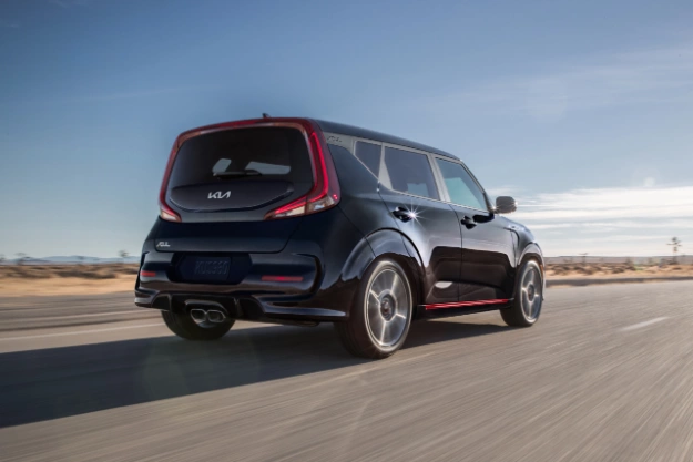 2022 Kia Soul Driving On An Open Road In The Desert Rear Three-Quarter View