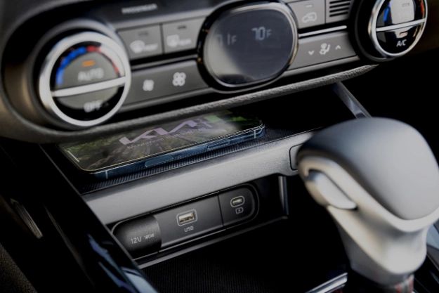 2024 Kia Soul Utilizing Wireless Phone Charger Close-Up