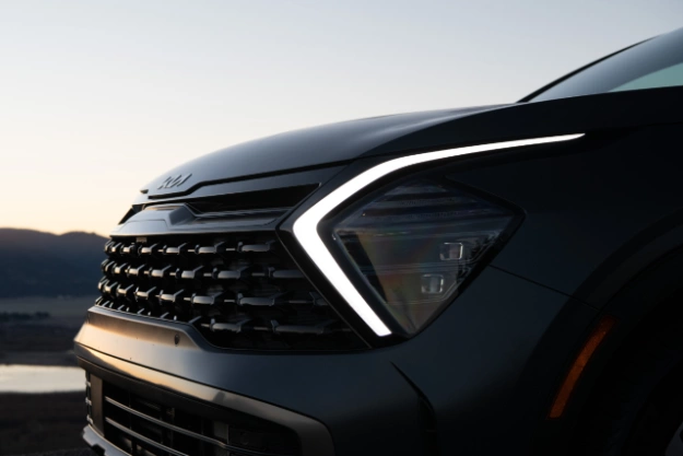 2023 Kia Sportage Plug-In Hybrid Front Grille And LED Headlights Close-Up Side View