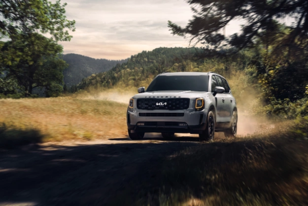 2022 Kia Telluride Driving Off Road In The Mountains Three-Quarter View