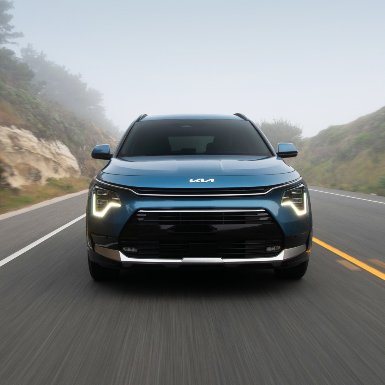 2024 Kia Niro Plug-In Hybrid Accelerating Fast On An Empty Foggy Road Front-View